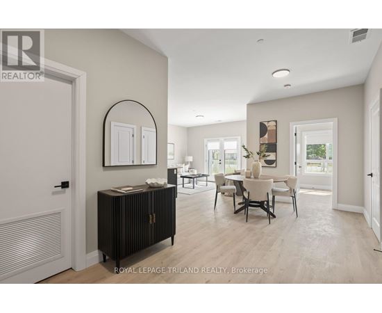 A well-lit, spacious room with a dining table and chairs.