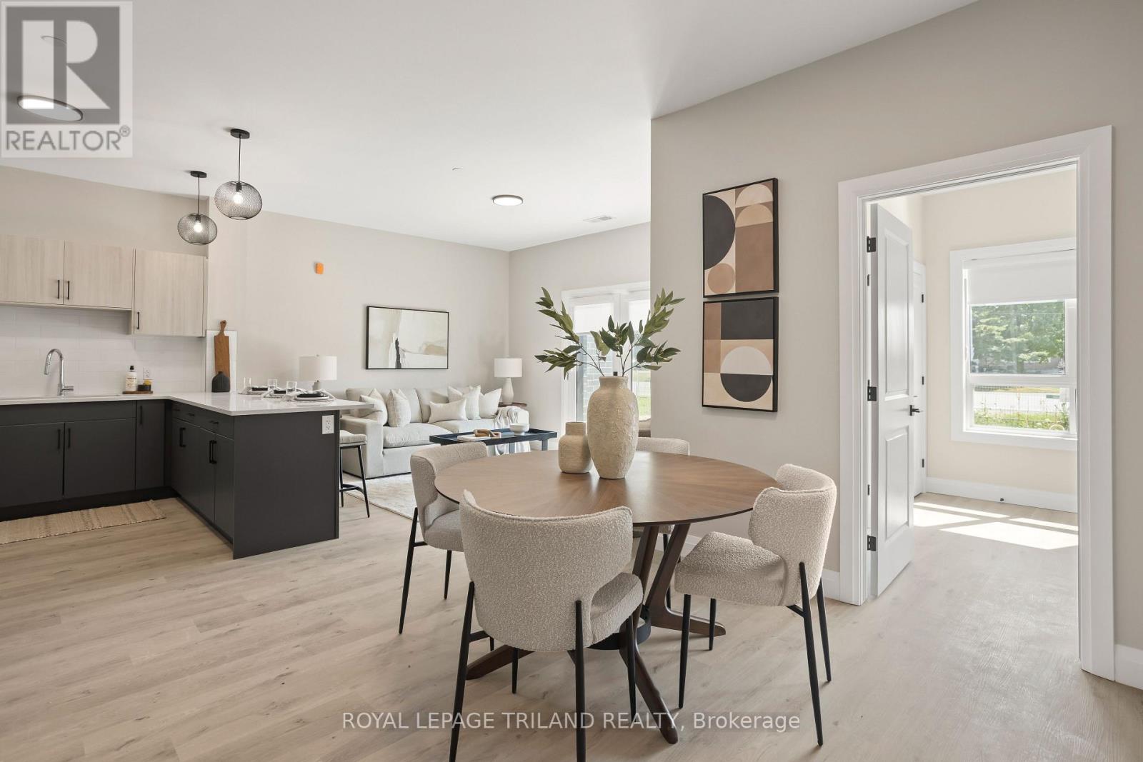 A modern kitchen with a dining table set for four.