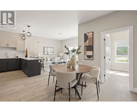 A modern kitchen with a dining table set for four.