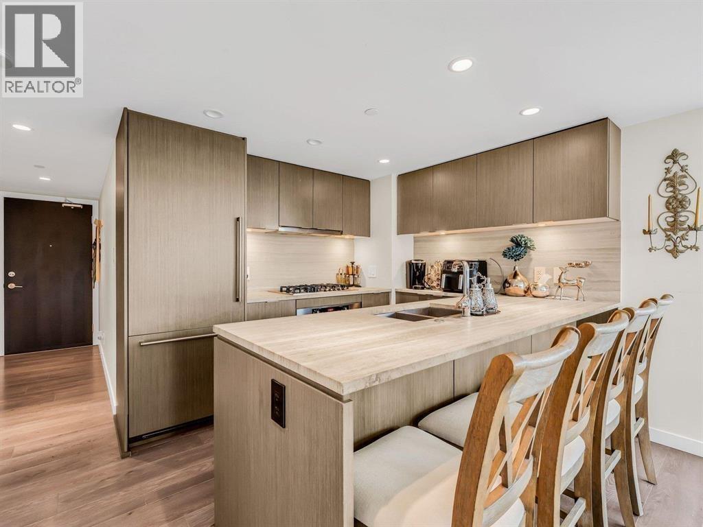 A modern kitchen with wooden cabinets and a center island.