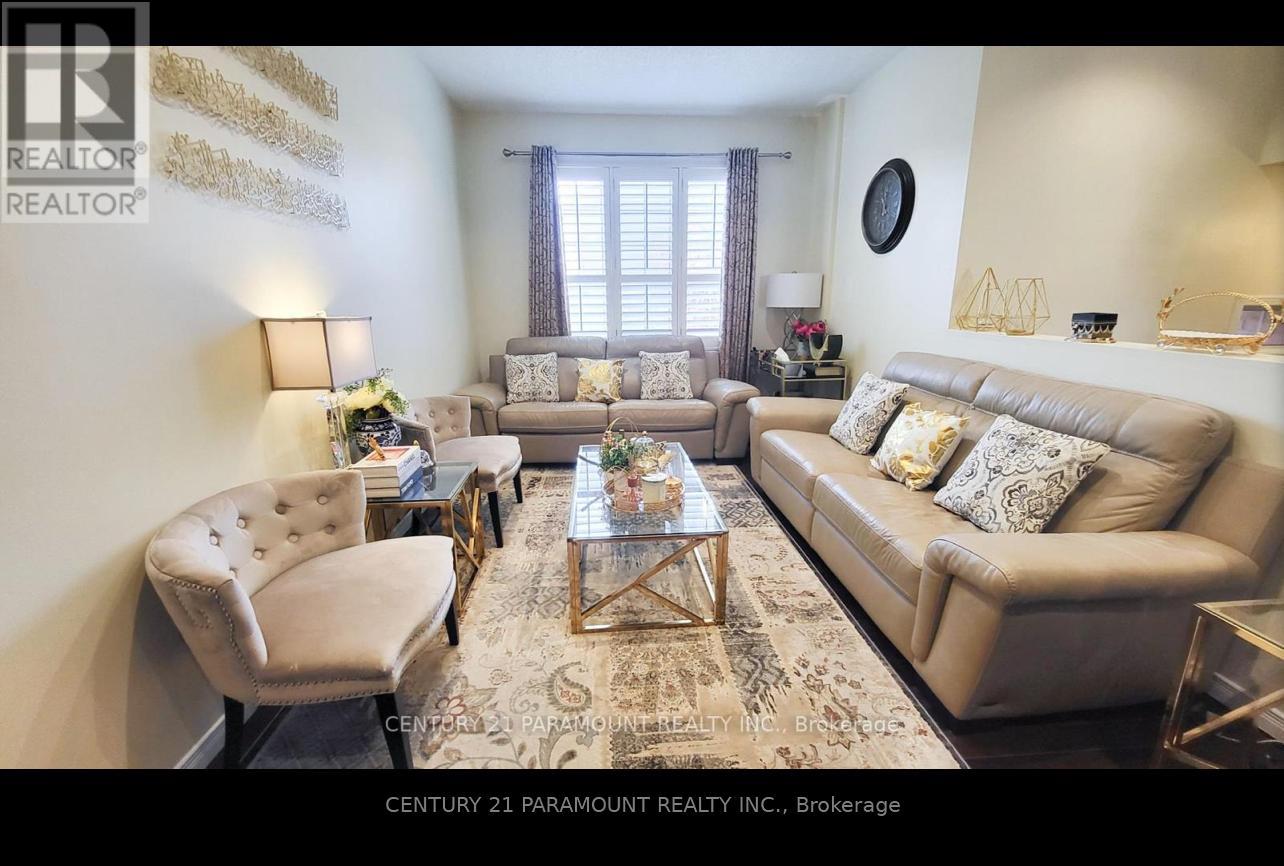 A living room with a beige sofa, a chair, and a coffee table.