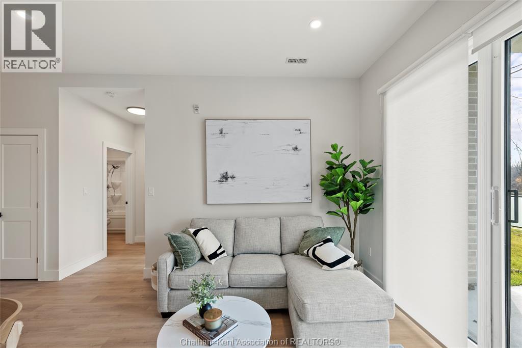 A living room with a grey couch and a coffee table.