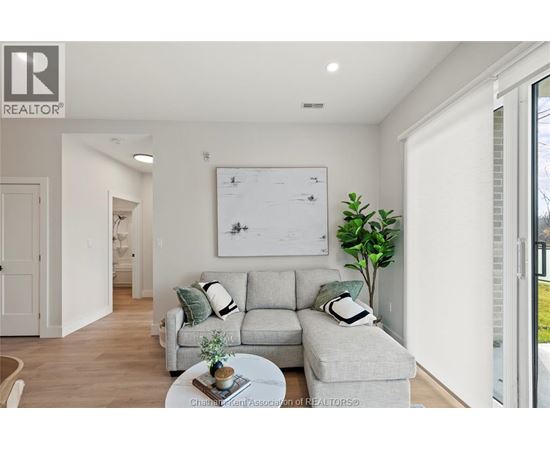 A living room with a grey couch and a coffee table.