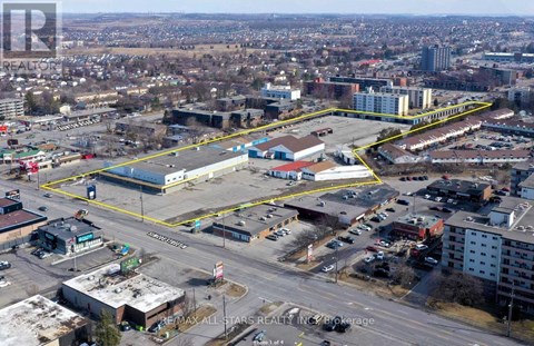 An aerial view of a city with a large yellow rectangle in the center.