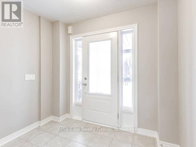 A white door is in a room with white walls.