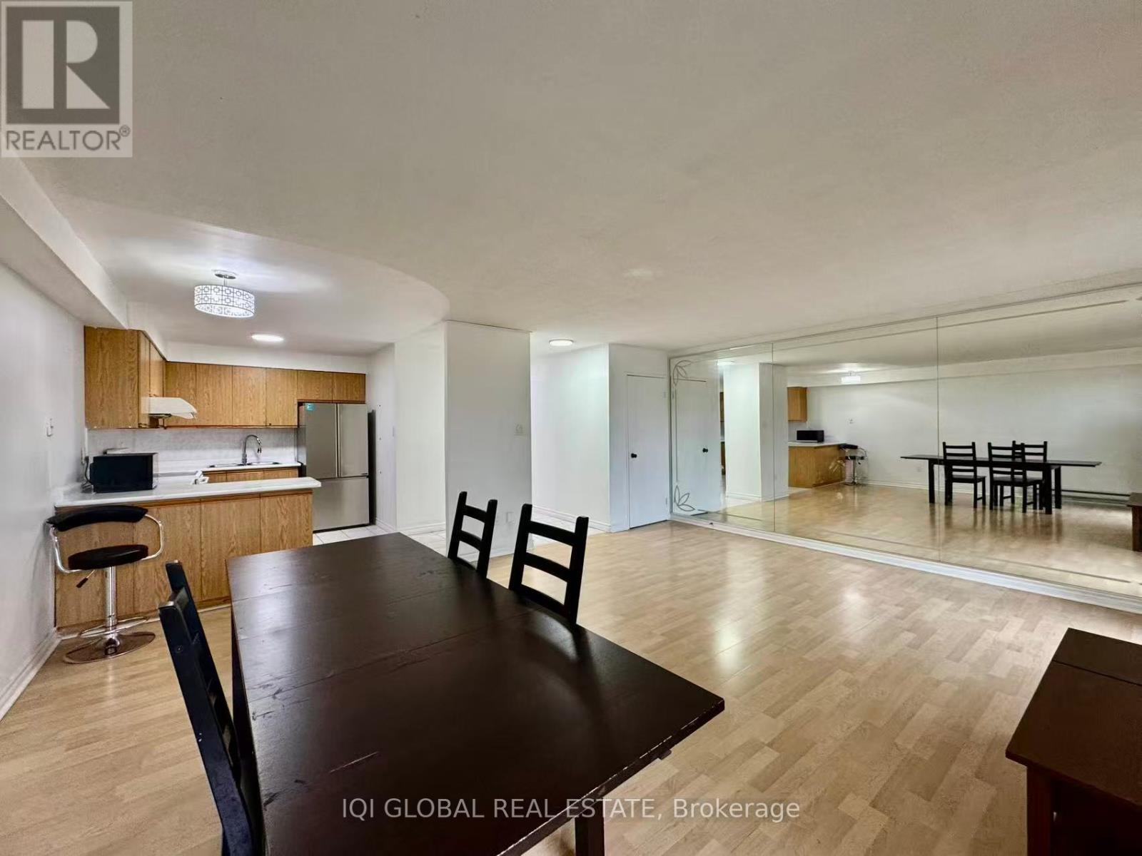 A dining room with a table and chairs is shown.