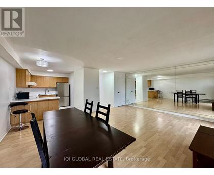 A dining room with a table and chairs is shown.