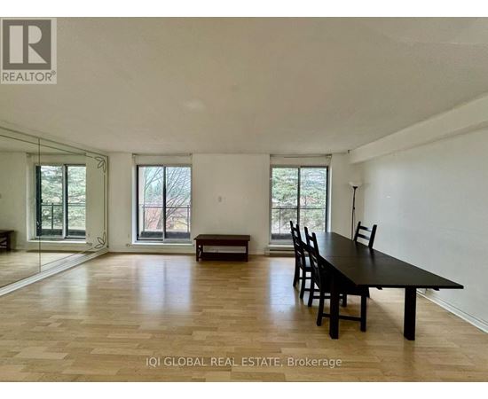 A spacious room with a long table and chairs is available for rent.