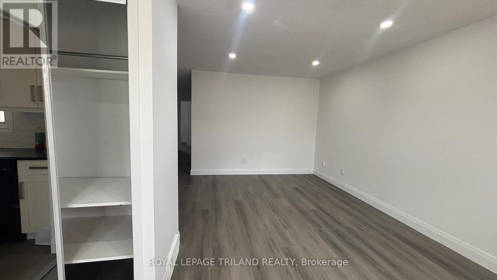 A white wall with a sign that says REALTOR.