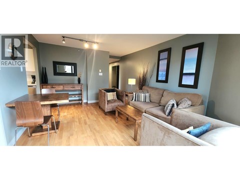 A living room with a brown chair and a brown couch.