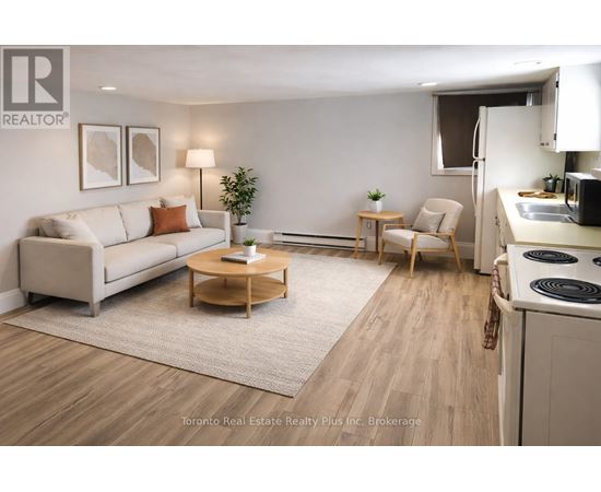A well-lit, modern living room with a kitchen area in the background.