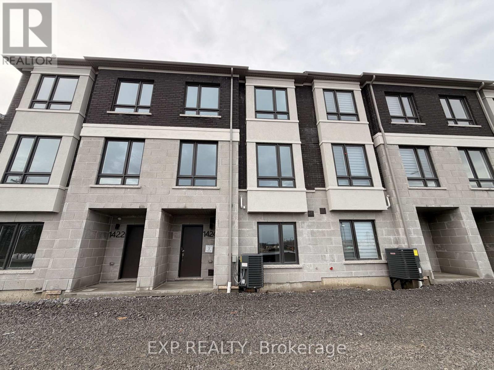 A building with the text EXP REALTY Brokerage on the bottom right.