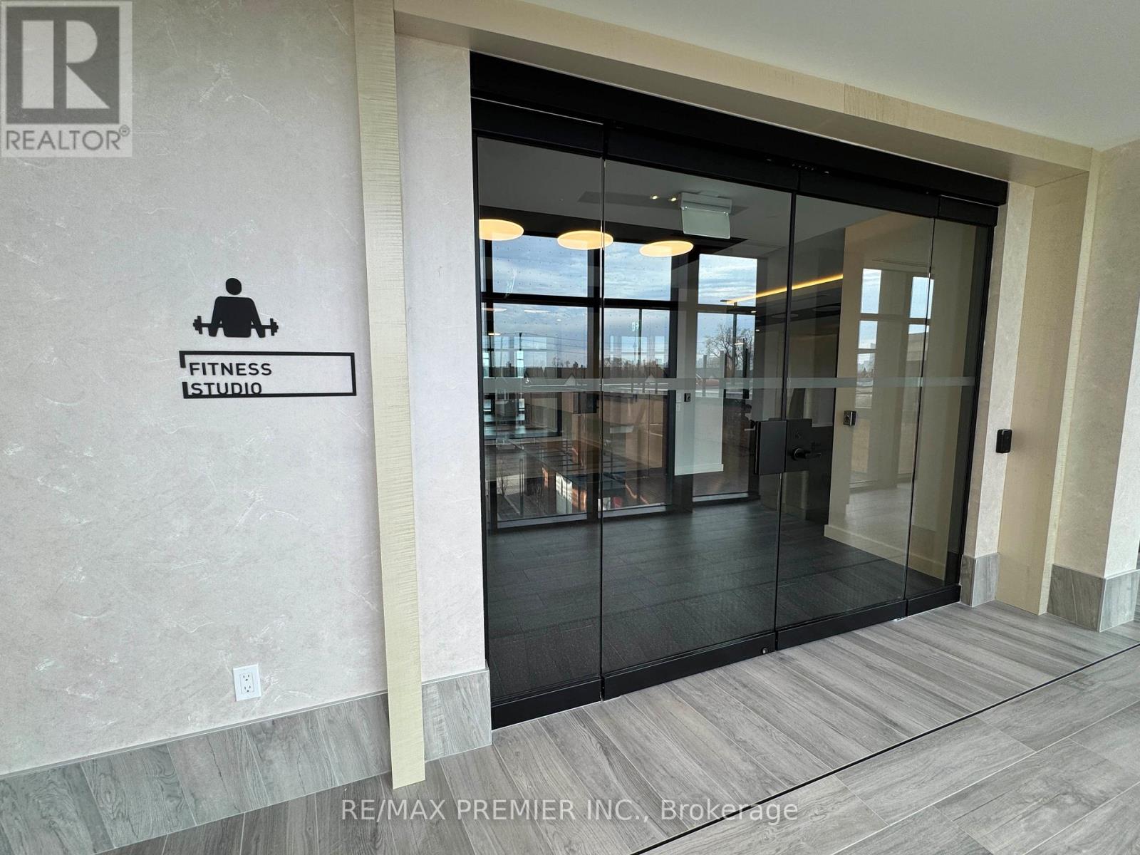 A fitness studio is located in the lobby of a building.
