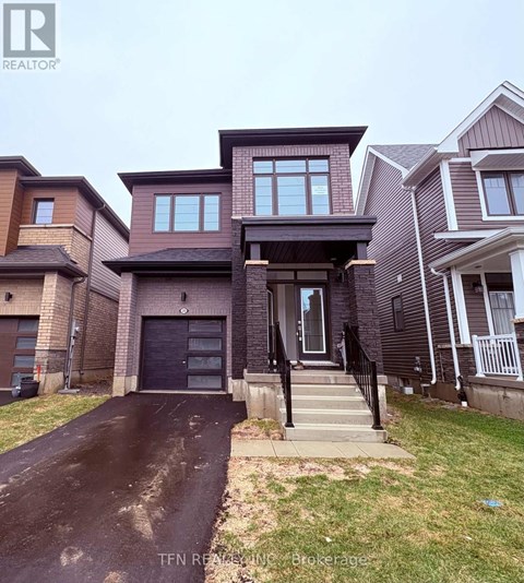 A house with a driveway in front of it.
