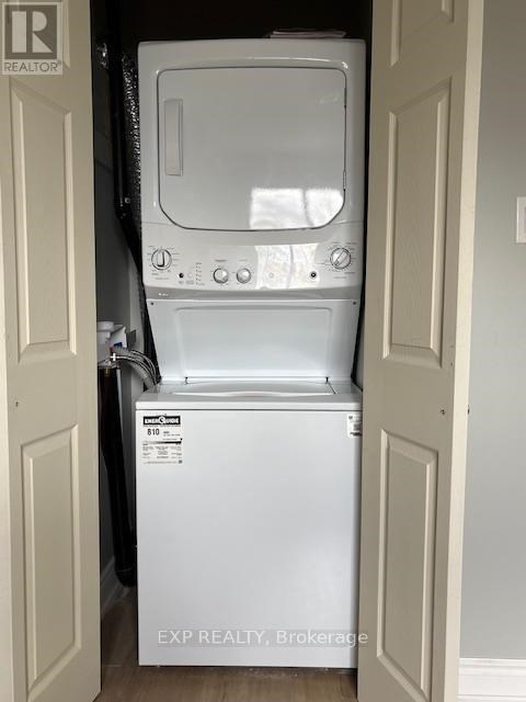 A white dishwasher is in a small space between two doors.