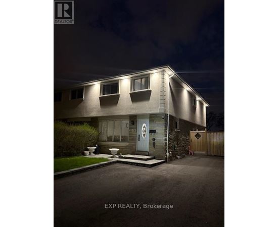 A house with a sign that says EXP REALTY, Brokerage.