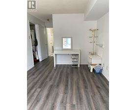 A room with a desk and a chair in it.