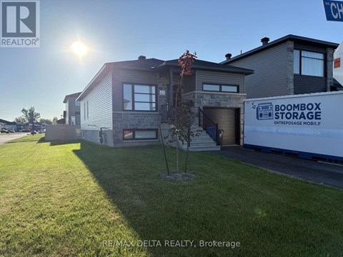 A house with a storage unit in front of it.