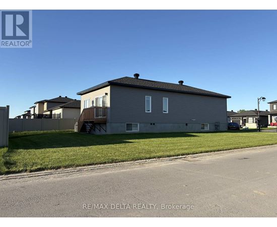 A house with a grey facade is for sale in Brokerage by RE/MAX Delta Realty.