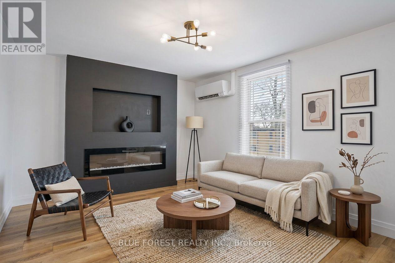 A living room with a fireplace and a couch.