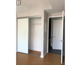 A white door with a glass panel is open.