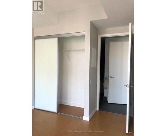 A white door with a glass panel is open.