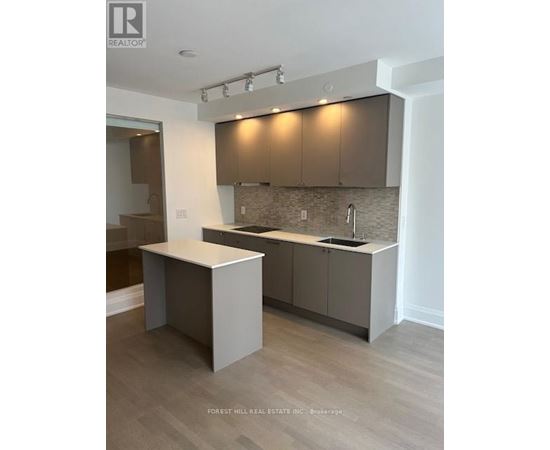 A kitchen with a sink and cabinets.