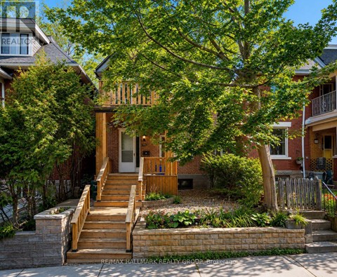 A house with a tree in front of it.