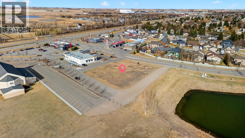 A small town with a lake and a parking lot.