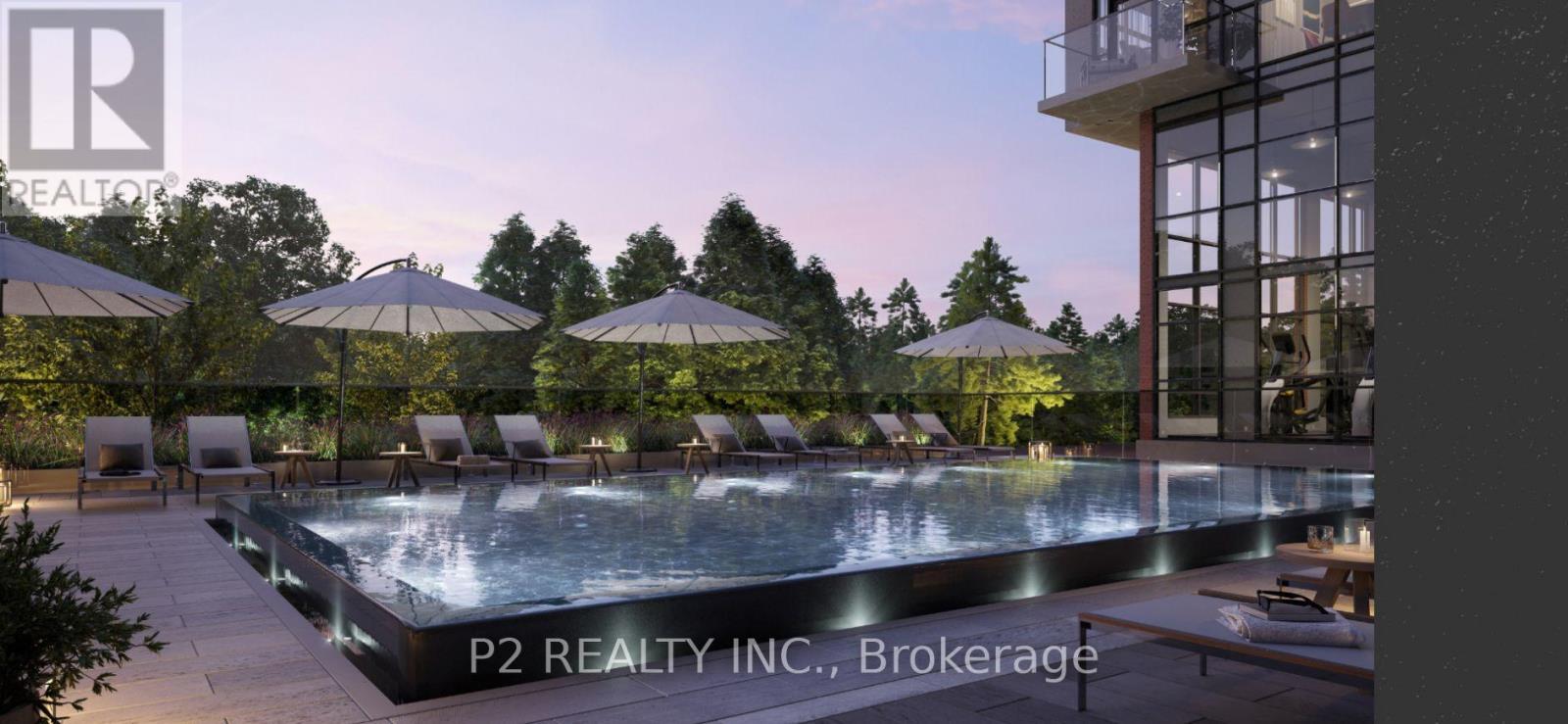 A pool area with lounge chairs and umbrellas is part of a realty company's brokerage.