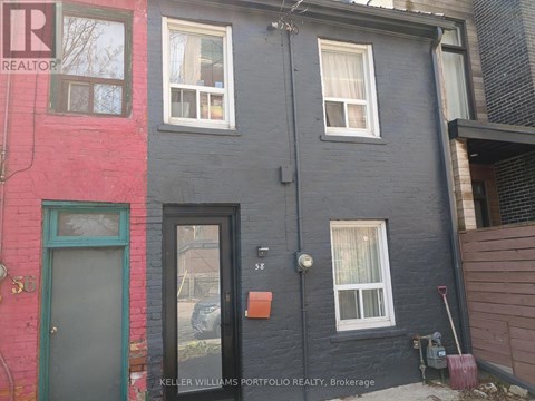 A building with a red and blue facade is for sale.
