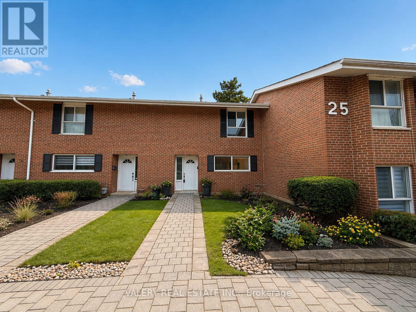 A brick building with the number 25 on it.