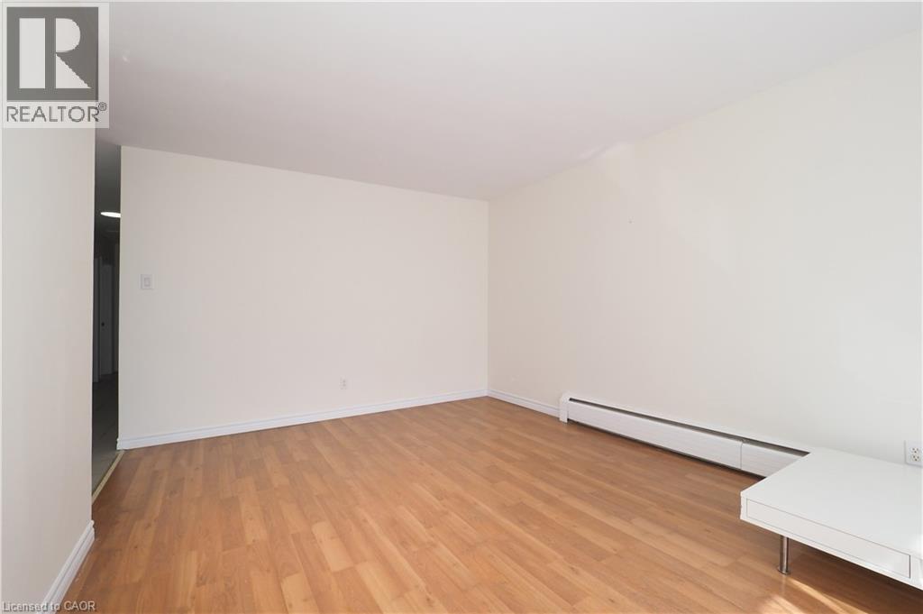 A room with wooden floors and white walls.