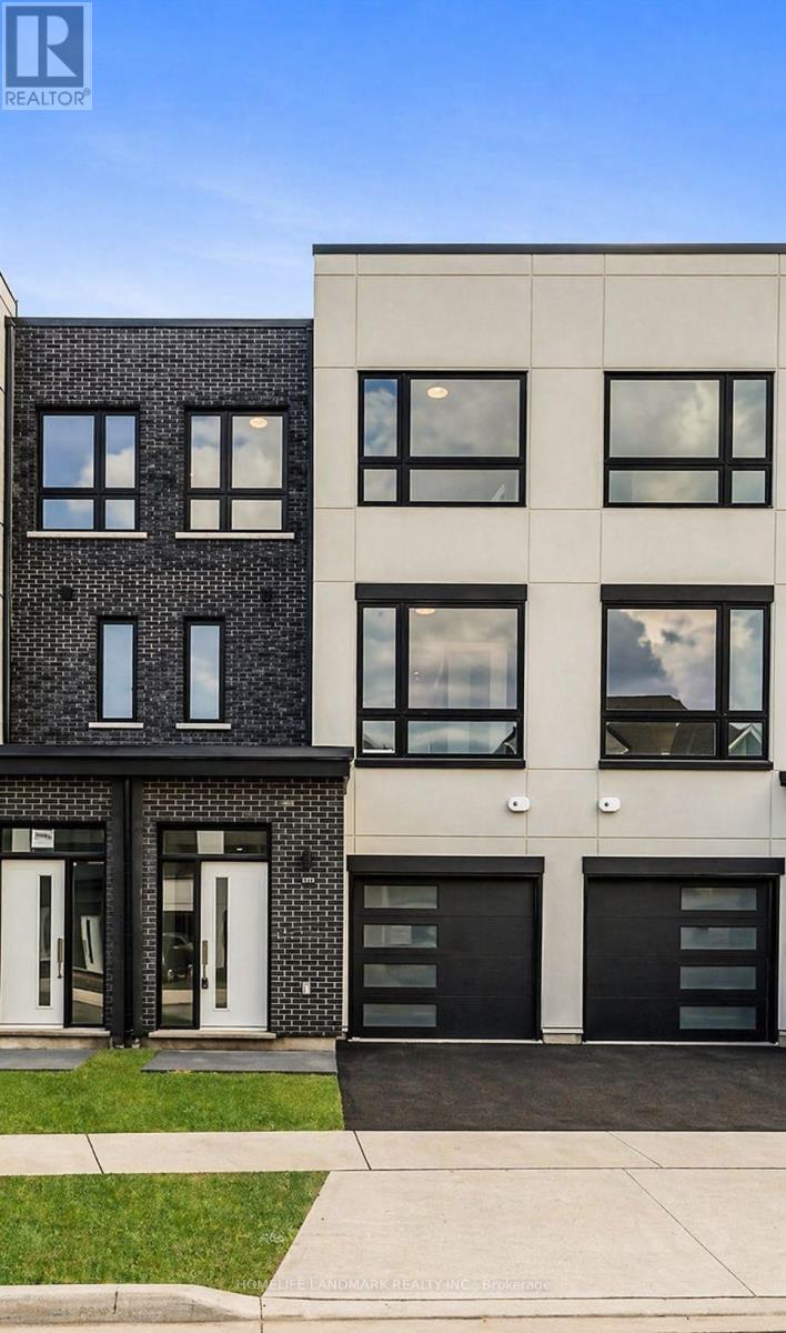A modern two-story building with a black and white facade.
