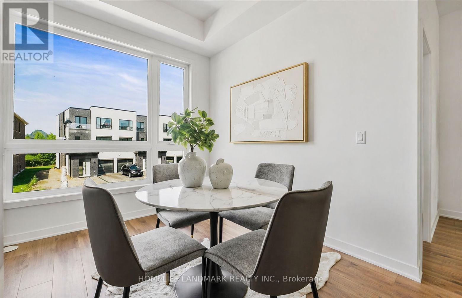 A dining room with a table set for four.