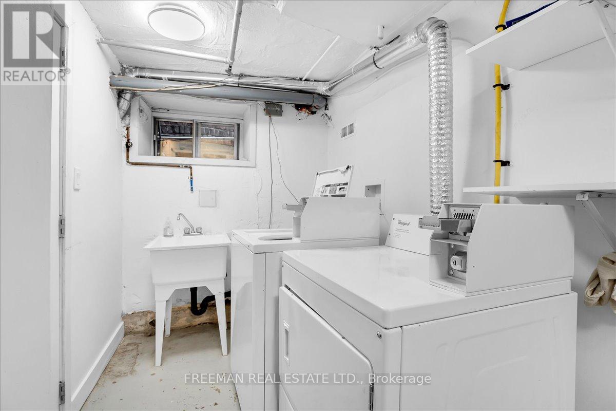 A white sink and table in a small room.