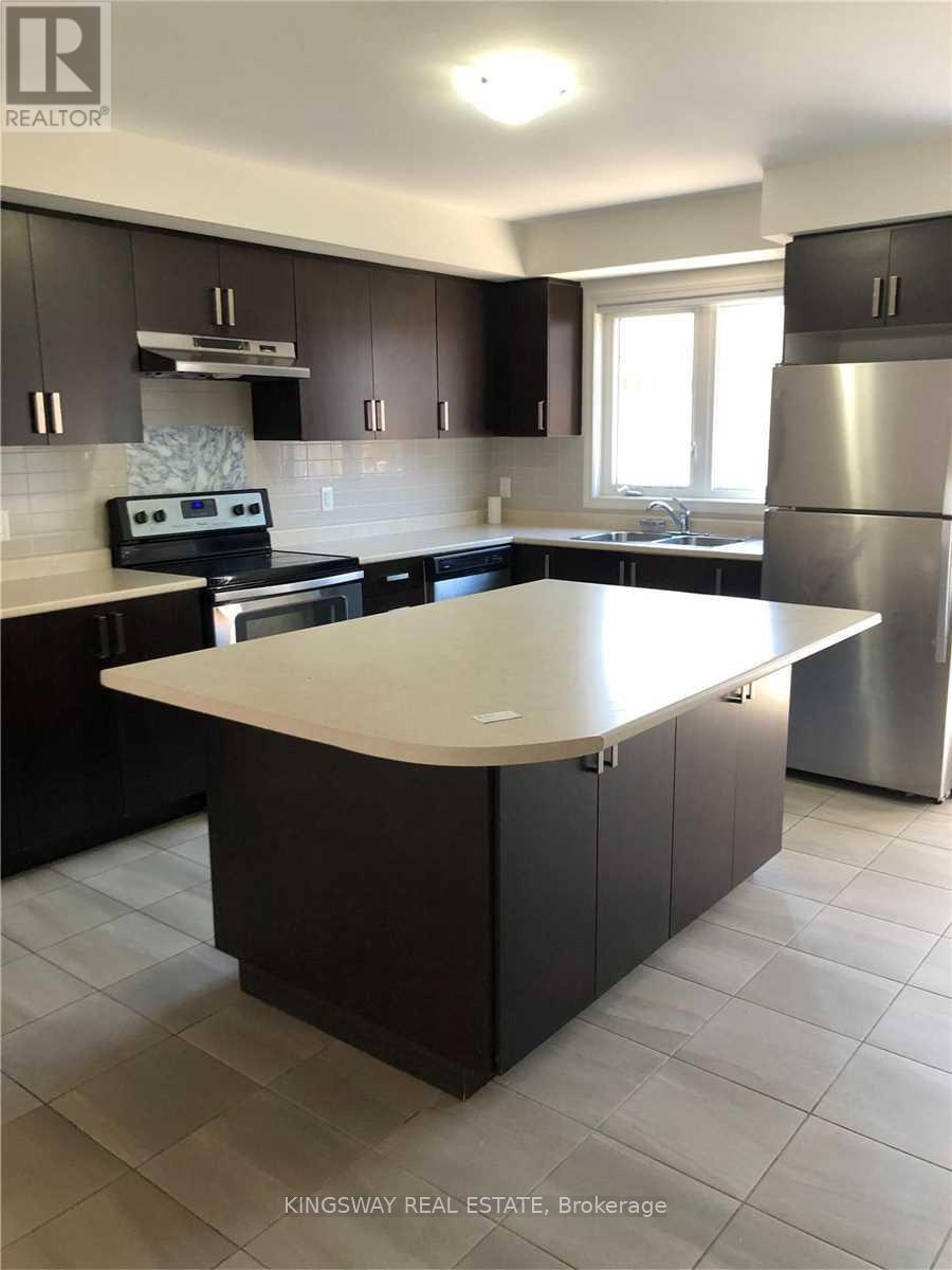 A kitchen with a large island in the middle.