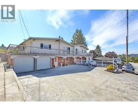 A large house with a garage is for sale.