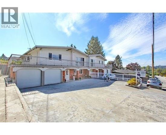 A large house with a garage is for sale.