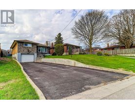 A residential area with a house and a driveway.