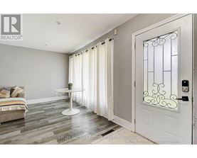 A white door with a glass window and a metal frame is on the right side of the image.
