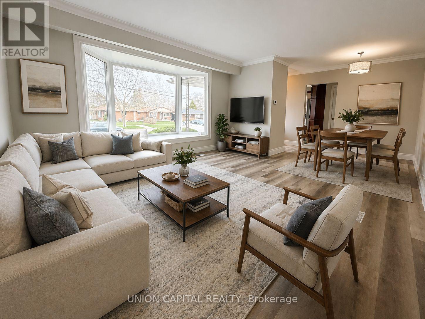 A living room with a white couch and a coffee table.