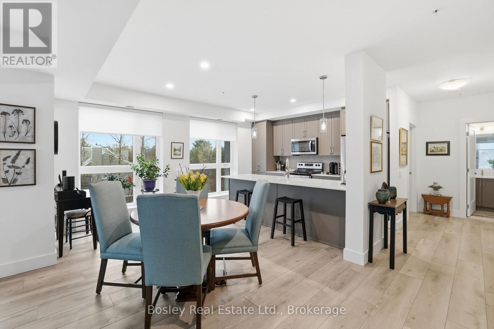 A modern dining room with a large table and chairs.