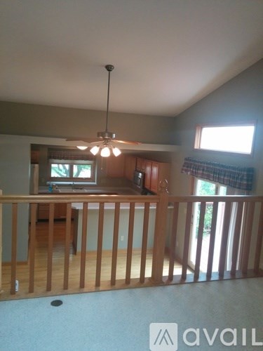 A living room with a television and a balcony.