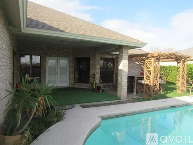 A house with a pool in the backyard.