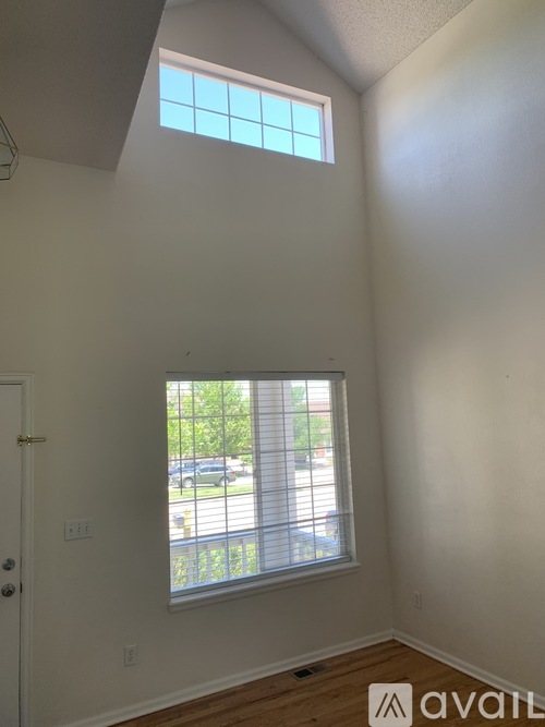 A room with a window and a door.