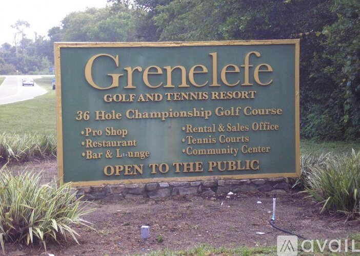A sign for Grenelefe Golf and Tennis Resort lists the amenities available to guests.