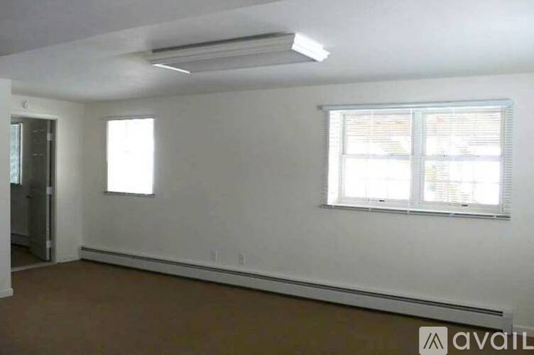 A room with a window and a door.