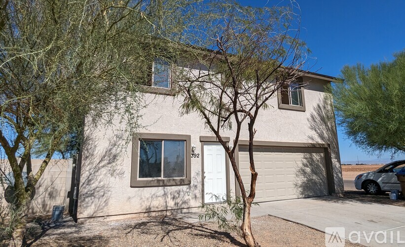 A house with a tree in front of it.