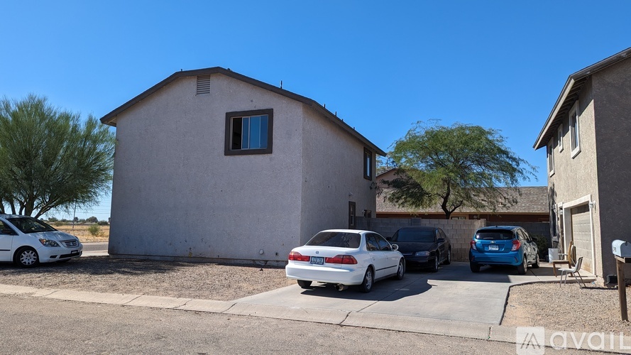A house with a car parked in front of it.